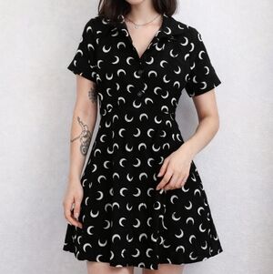 Stylish Black and White Mini Dress Cresent Moon, it has‎ pockets.